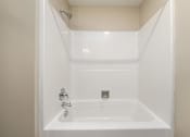 Thumbnail 13 of 16 - A white bathroom sink with a silver faucet.