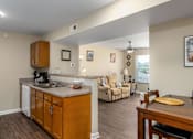 Thumbnail 13 of 41 - kitchen and living room at the reserve at johns creek walk