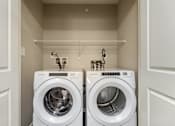 Thumbnail 27 of 41 - the apartments at lux 96 laundry room with washer and dryer
