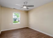 Thumbnail 23 of 36 - an empty room with a ceiling fan and a window