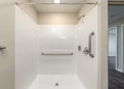Thumbnail 34 of 36 - a bathroom with a shower and a sink