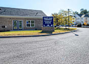 Thumbnail 54 of 55 - A sign in front of a building that says White Oak Crossing.