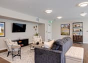 Thumbnail 4 of 27 - a living room with couches and chairs
