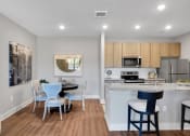 Thumbnail 24 of 30 - Dining Area and Kitchen