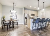 Thumbnail 6 of 23 - a kitchen and dining area in a 555 waverly unit