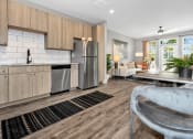 Thumbnail 1 of 24 - Kitchen and Living Room