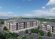 Thumbnail 14 of 14 - A large, modern building complex with a parking lot in front.