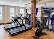Thumbnail 12 of 21 - Treadmills, rowing machine and stationary bike in the cardio fitness center at Argento on the Broad in Arden, NC