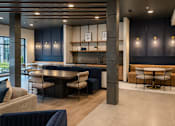 Thumbnail 16 of 21 - Clubroom with group workspace, café seating and kitchenette at Argento on the Broad in Arden, NC