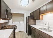 Thumbnail 10 of 16 - Kitchen and Laundry Room