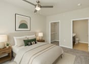 Thumbnail 3 of 15 - A bedroom with a bed, nightstands, and a ceiling fan.