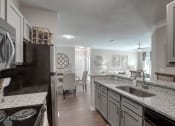 Thumbnail 15 of 21 - Kitchen and Dining Area