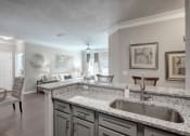 Thumbnail 2 of 21 - Kitchen and Living Room