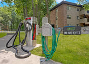 Thumbnail 13 of 22 - a hoses stand next to a car care center sign