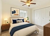 Thumbnail 4 of 20 - A bedroom with a bed, a ceiling fan, and a nightstand with a lamp.