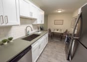 Thumbnail 2 of 9 - Kitchen and Dining Area
