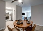 Thumbnail 12 of 15 - Dining Room, Kitchen, and Living Room
