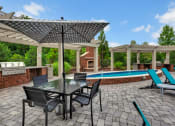 Thumbnail 6 of 16 - Resort-style Swimming Pool and Deck