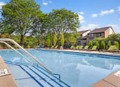 Thumbnail 4 of 18 - Resort-style Swimming Pool and Deck