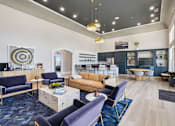 Thumbnail 8 of 30 - A modern living room with a blue carpet and furniture.
