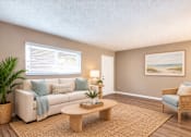 Thumbnail 8 of 24 - Virtually staged living room with a sofa, accent chair and window at Waterchase Apartments in Largo, FL.
