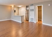 Thumbnail 16 of 24 - Unfurnished studio showing the open living area, breakfast bar and kitchen at Waterchase Apartments in Largo, FL.
