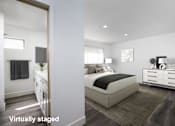 Thumbnail 14 of 63 - A bedroom with a bed, nightstand, and dresser.