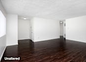 Thumbnail 8 of 18 - A room with wooden floors and white walls.