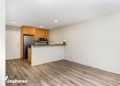 Thumbnail 5 of 45 - A kitchen with wooden cabinets and a white countertop.