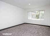 Thumbnail 6 of 52 - A room with unaltered carpeting and a window with blinds.