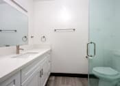 Thumbnail 47 of 52 - a white bathroom with a toilet and a sink