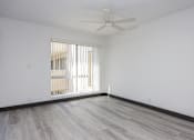 Thumbnail 48 of 52 - an empty room with white walls and a ceiling fan