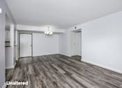 Thumbnail 11 of 53 - A room with unaltered wood flooring and white walls.