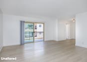 Thumbnail 18 of 41 - A room with unaltered flooring and a sliding glass door.