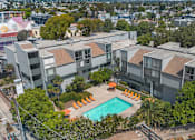 Thumbnail 1 of 45 - An aerial view of a residential complex with a swimming pool.