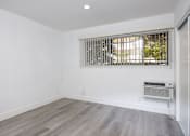 Thumbnail 22 of 63 - an empty room with white walls and a window