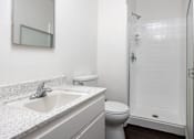 Thumbnail 17 of 18 - a bathroom with a sink toilet and shower