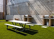 Thumbnail 4 of 18 - a picnic table and a bench in a backyard