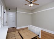 Thumbnail 13 of 18 - an empty room with a desk and a ceiling fan