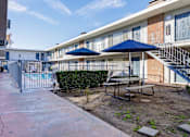 Thumbnail 4 of 28 - courtyard with tables and umbrellas