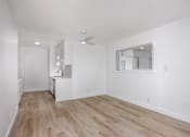 Thumbnail 44 of 63 - A room with wooden flooring and white walls.