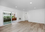 Thumbnail 47 of 63 - A room with wooden flooring and white walls.