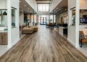 Thumbnail 12 of 17 - Caprock Crossing Apartments in College Station, TX Clubhouse with seating area and communal kitchen