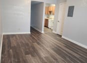 Thumbnail 13 of 29 - A room with wooden flooring and a ceiling fan.