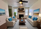 Thumbnail 1 of 20 - a living room with couches and a coffee table