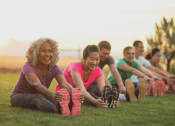 Thumbnail 20 of 20 - a group of people sitting on the grass