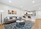Thumbnail 4 of 18 - Living Area With Kitchen View at Roosevelt Commons Apartments, Philadelphia, Pennsylvania