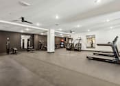 Thumbnail 50 of 57 - A spacious gym with various exercise equipment.