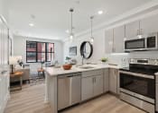 Thumbnail 1 of 24 - Kitchen and living room at The Anchorage on Kelly, East Falls, PA