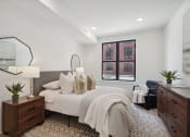 Thumbnail 8 of 24 - a bedroom with a large bed and a large window  at The Anchorage on Kelly, East Falls